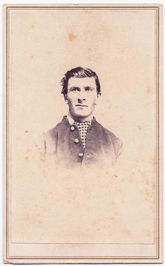 18TH U.S. INFANTRYMAN: 18TH U.S. INFANTRYMAN Carte de visite photograph of James Curl[?] who adds "18th US Infantry" on the verso of the image showing him in a portrait in civilian garb.