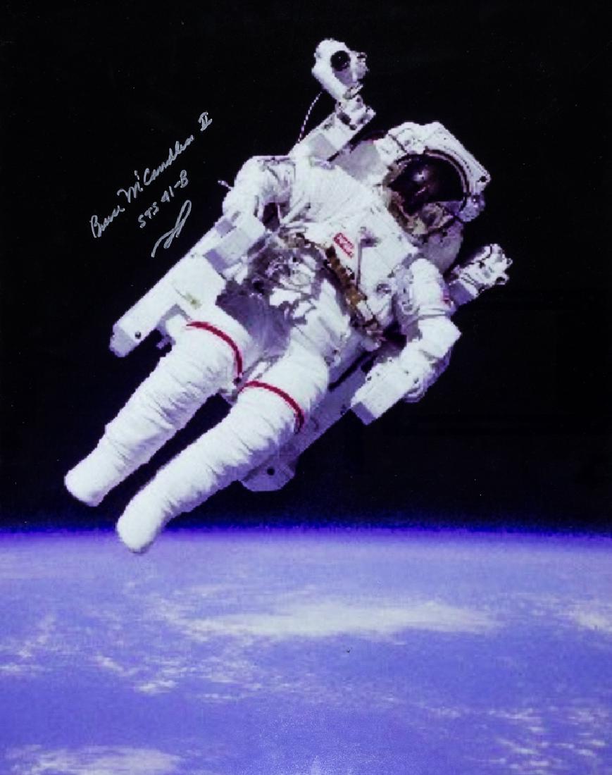 BRUCE MCCANDLESS II: BRUCE MCCANDLESS II (b.1937) American naval officer and former NASA astronaut, made the first ever untethered spacewalk using the Manned Maneuvering Unit. Lot of two I.S.P.s, each 16” x 20” color,