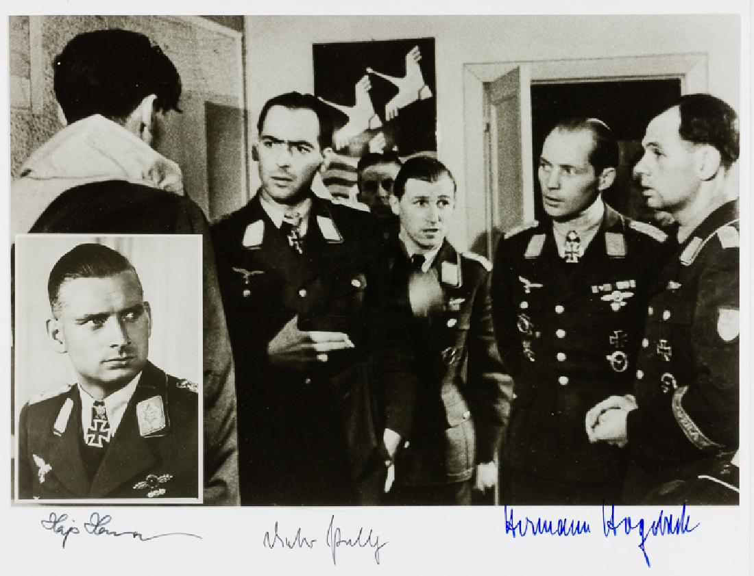 LUFTWAFFE TOP BOMBERS SIGNED PHOTO: LUFTWAFFE TOP BOMBERS SIGNED PHOTO Fine quality signed composite photo, 9 Â½" x 12" b/w, signed by Knights Cross recipients DIETRICH PELTZ, HERMANN HOGEBACH, and HAJO HERMANN. Fine.