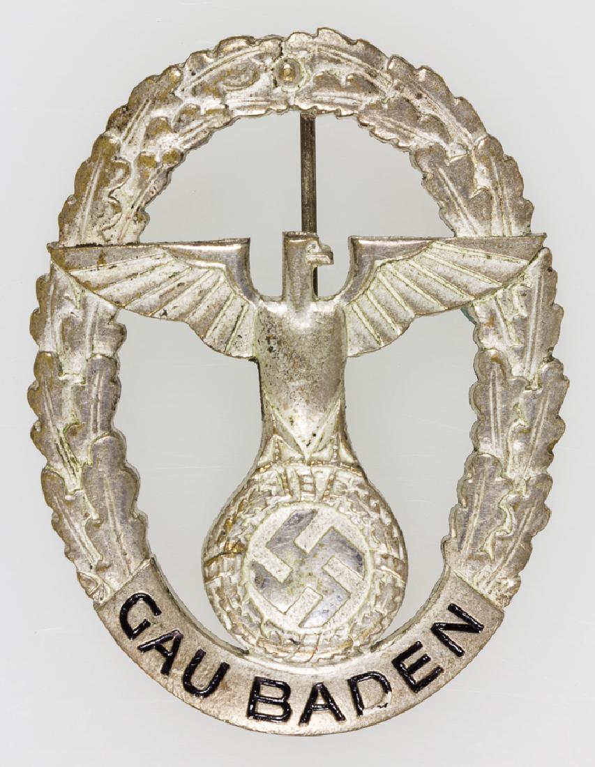 GAU BADEN HONOR BADGE: GAU BADEN HONOR BADGE Rare metal badge, 1 1/4" x 1 3/4", a Gau Baden Honor Badge. The badge features a chromed stylized political eagle within an oval wreath, with the legend "Gau Baden" applied at th