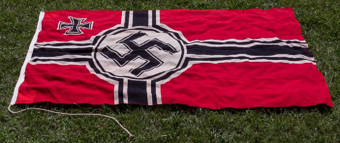 THIRD REICH REICHSKRIEGSFLAGGE: THIRD REICH REICHSKRIEGSFLAGGE Large "Reichskriegsflagge", 97" x 55", a "second pattern" example, constructed of red wool bunting, clamp-dyed with a mobile swastika within a white disk, offset to the 