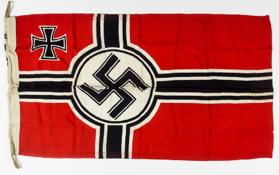 THIRD REICH REICHSKRIEGSFLAGGE: THIRD REICH REICHSKRIEGSFLAGGE Third Reich-era "Reichskriegsflagge", 34" x 18", of one-piece construction, depicting a black and white cross offset towards the hoist, with a black mobile swastika with