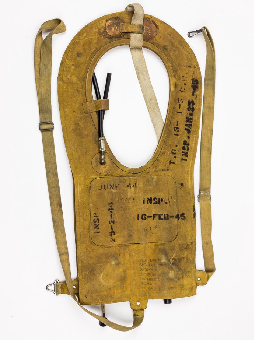 B-4 "MAE WEST" LIFE PRESERVER: B-4 "MAE WEST" LIFE PRESERVER American Type B-4 "Mae West" inflatable life preservers commonly worn by airmen during World War II. The vest is inflated by two carbon dioxide cartridges, one of which a