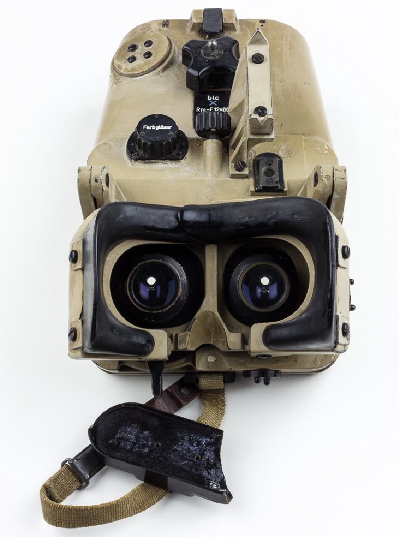GERMAN PANZER TANK BINOCULARS: GERMAN PANZER TANK BINOCULARS German tank binoculars madse by Zeiss Jena, about 12" x 7" with a sand-colored steel body. Flip-open rubber-lined eye cups with individually-adjustable eye pieces (optics