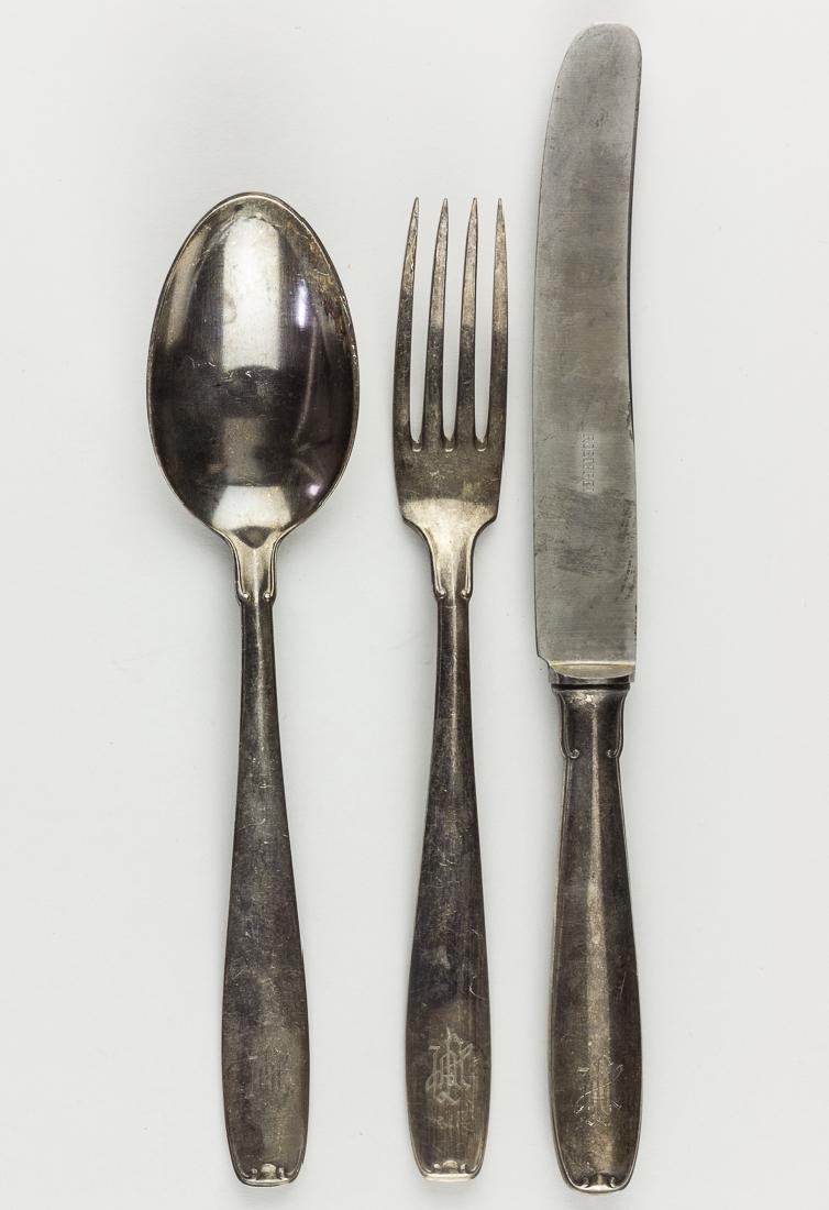 LEIBSTANDARTE ADOLF HITLER TABLEWARE (3): LEIBSTANDARTE ADOLF HITLER TABLEWARE (3) Three pieces of Leibstandarte Adolf Hitler Division matching silver-plated tableware, includes dinner fork (8 1/4" long), knife (10" long) and soup spoon (8 1/