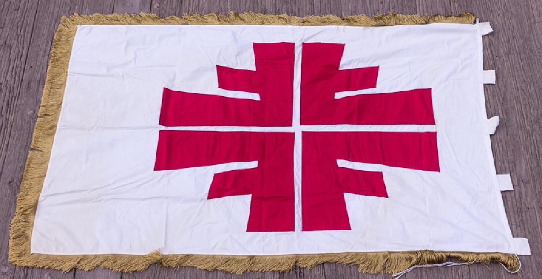 DEUTSCHES TURNERBUND FLAG: DEUTSCHES TURNERBUND FLAG Large white cloth flag, 58" x 37", with the red four-F insignia of the Deutsches Turnerbund ("German Gymnastics Association") sewn onto both sides. Three edges bear a 2 3/4" 