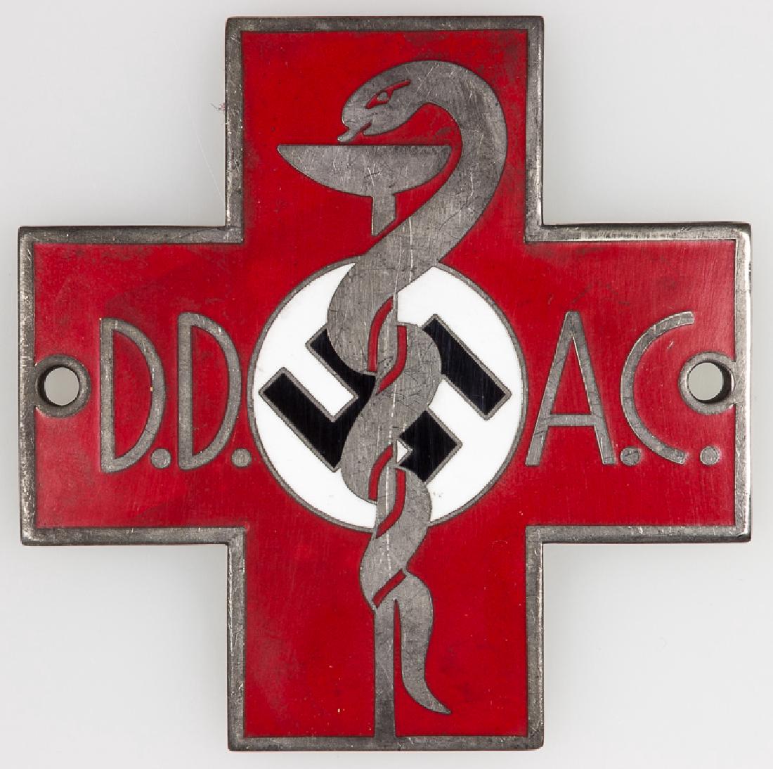 "GERMAN AUTO CLUB" AMBULANCE PLAQUE: "GERMAN AUTO CLUB" AMBULANCE PLAQUE Rare German sliver plaque, 3 1/4" square, depicting a red cross in enamel, with a caduceus over a white disk containing a mobile swastika at center, and with the in