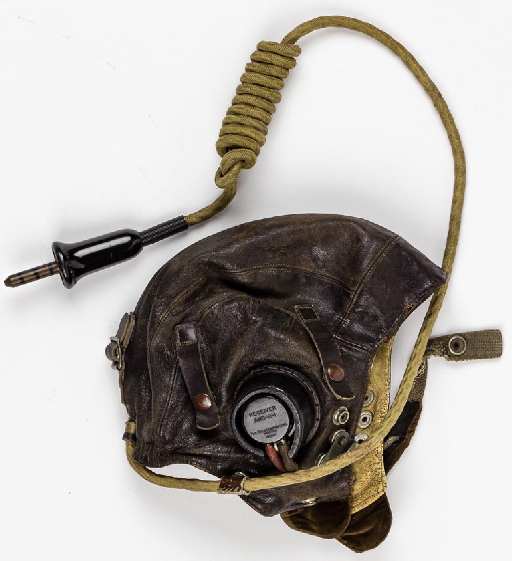 (ZEMKE'S WOLF PACK) R.A.F. 1ST PATTERN TYPE C LEATHER: (ZEMKE'S WOLF PACK) R.A.F. 1ST PATTERN TYPE C LEATHER FLIGHT HELMET Leather Royal Air Force aviator's flying cap with built-in radio headphones, issued to a member of "Zemke's Wolf Pack", the 56th Fig