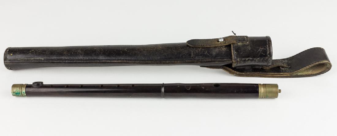 GERMAN FIFE WITH CASE: GERMAN FIFE WITH CASE Scarce original manufacture German rosewood fife and leather cvase, both marked. The black leather belt case is maker marked and dated on the reverse of the belt loop: "OTTO SIND