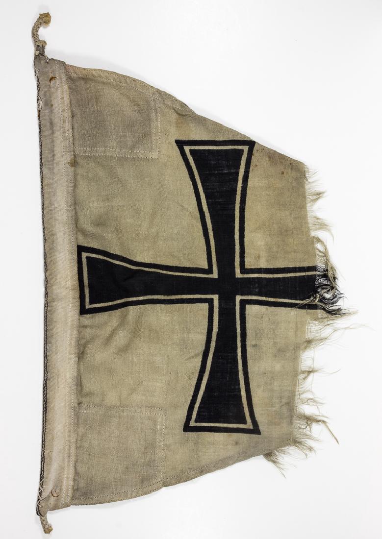 KAISERLICHE MARINE DIVISION PENNANT: KAISERLICHE MARINE DIVISION PENNANT Imperial German white wool bunting pennant, approx. 10 1/2" x 19", clamp-dyed with a black Iron Cross, as flown by the lead ship of a division of the Kaiserliche Ma