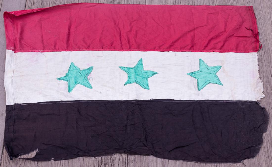IRAQI NATIONAL FLAG: IRAQI NATIONAL FLAG Pre-Gulf War Iraqi national flag, undoubtedly theater-made, 60" x 40", of rayon and woven cotton construction, depicting horizontal red-white-and-black bands, with three green star