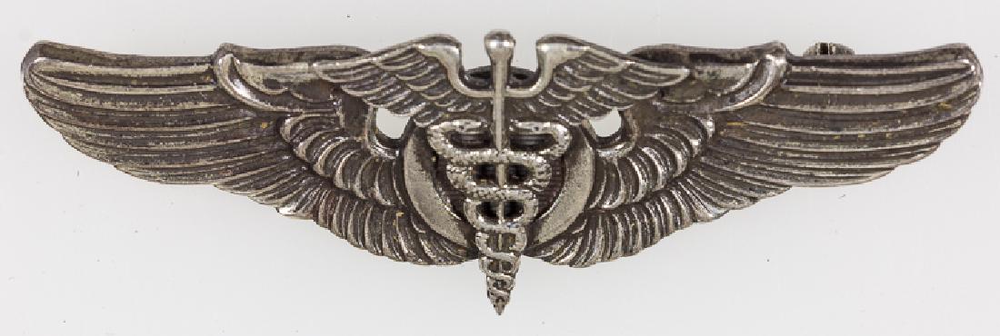 FLIGHT SURGEON SHIRT WING BY MEYER: FLIGHT SURGEON SHIRT WING BY MEYER Flight Surgeon Shirt Wings by Meyer and hallmarked with "N.S. MEYER INC. NEW YORK" and shield on the reverse, sterling silver, 2" wide, in fine condition. Pin will n