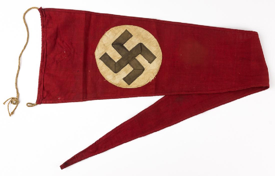 N.S.D.A.P. PENNANT: N.S.D.A.P. PENNANT Triangular pennant flag, 38 1/2" x 7 3/4", of double-sided red wool bunting with a white disk applied at center, bearing a two-piece mobile swastika of black cloth. A length of twin