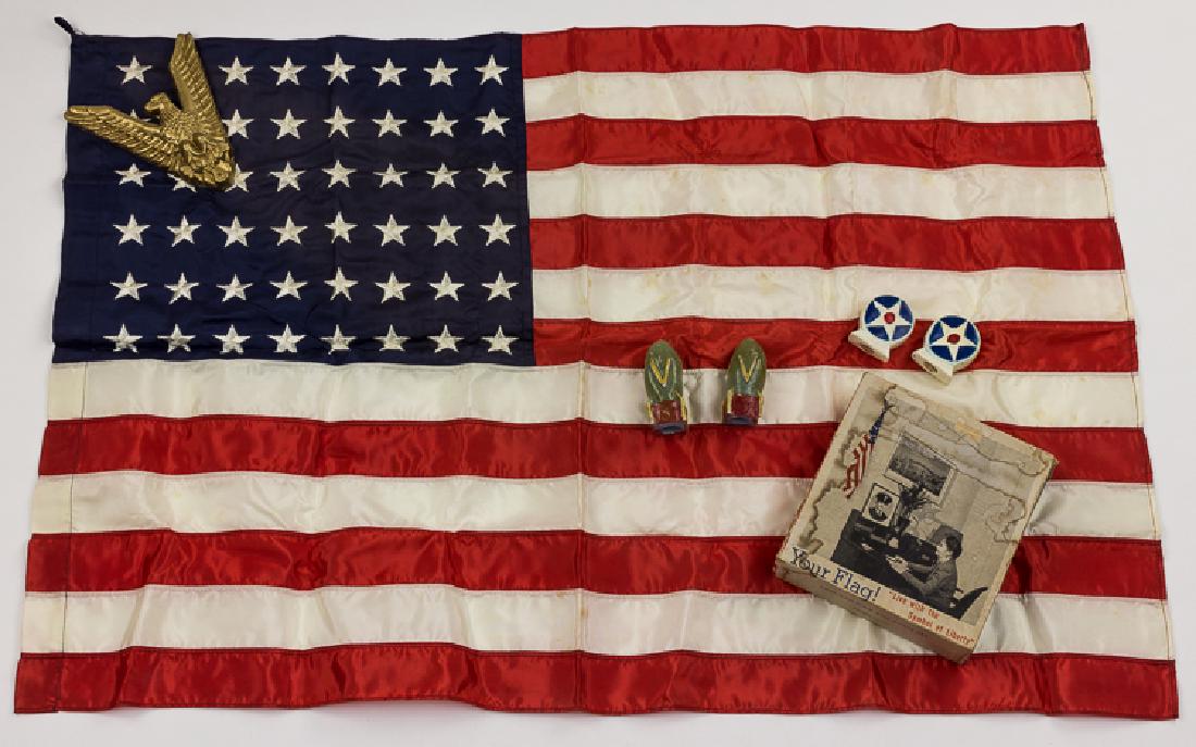 PATRIOTIC HOMEFRONT GROUP: PATRIOTIC HOMEFRONT GROUP Good lot of patriotic homefront items, includes nylon flag with 48 emboidered stars, 34" x 23" with plastic eagle "V" wall mount, two "V" salt and pepper shakers in the form 