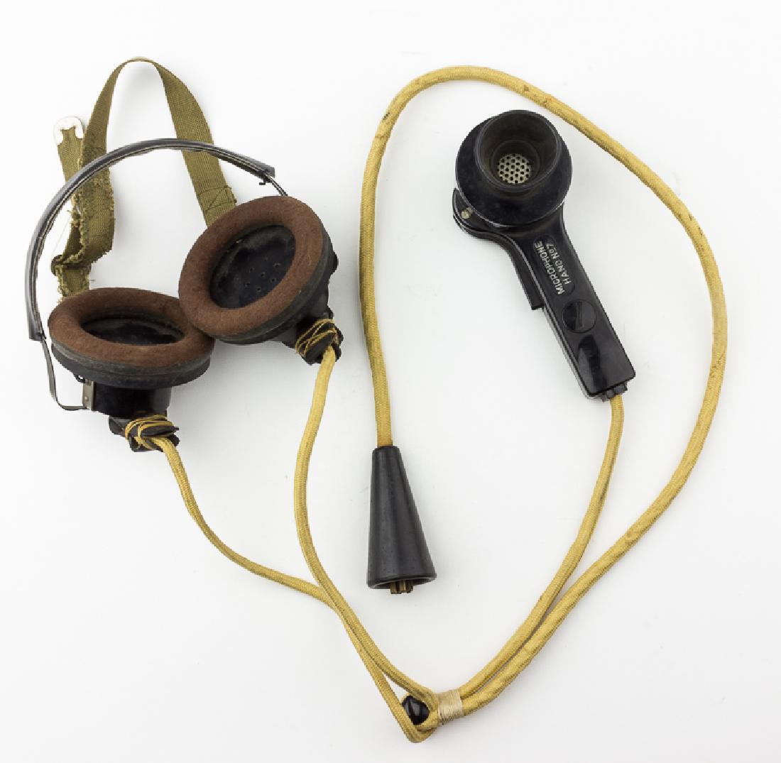 SHERMAN TANK HEADSET AND HAND-HELD MICROPHONE: SHERMAN TANK HEADSET AND HAND-HELD MICROPHONE A scarcely-seen relic, the paired headset and hand-held microphone commonly used on the American' army's Sherman tank. The headset bears a chin strap to s