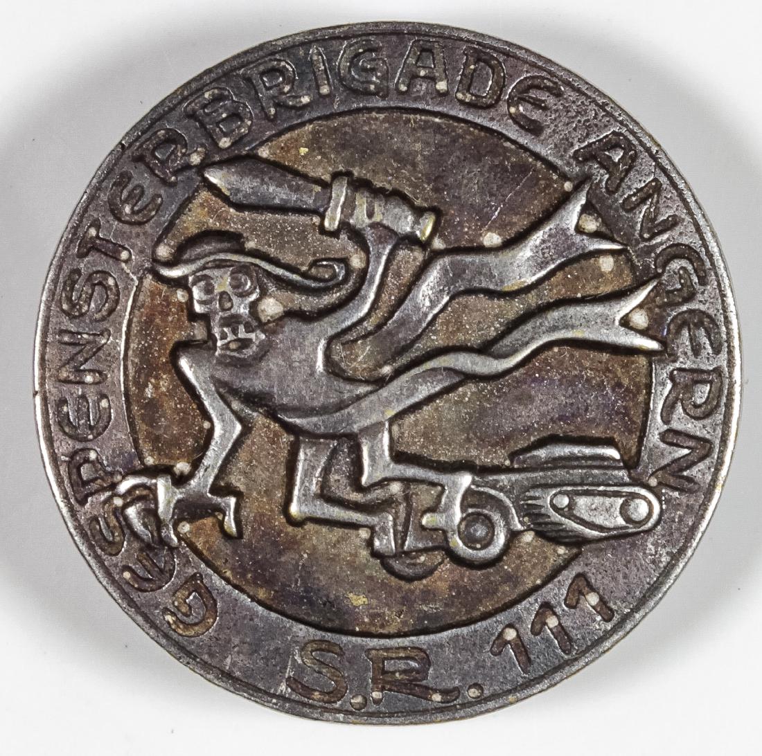 11TH PANZER DIVISION REGIMENTAL PIN: 11TH PANZER DIVISION REGIMENTAL PIN Very rare 11th Panzer Division, bears an image in relief of the division's emblem, a rather evil specter bearing a sword and leading a tank forward, surrounded by t