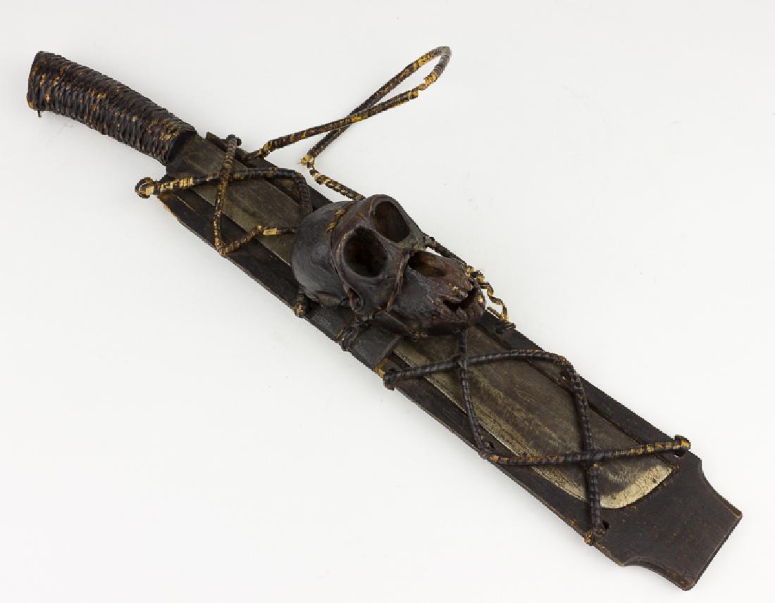 PHILIPPINES "HEADHUNTER" MACHETE WITH MONKEY SKULL: PHILIPPINES "HEADHUNTER" MACHETE WITH MONKEY SKULL An odd relic, almost certainly crafted as a souvenir for purchase by American soldiers stationed in the Philippines during and immediately after Worl