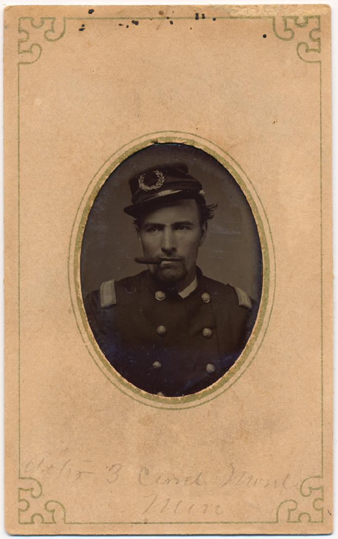 "LT. FRANCIS" CELEBRATES A THREE CARD MONTE WIN: "LT. FRANCIS" CELEBRATES A THREE CARD MONTE WIN A great CDV-sized mounted tintype of a Union lieutenant looking to his right with a cigar clamped in his mouth. A faded pencil note on the cardboard mou