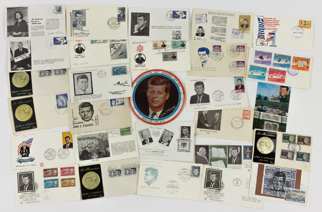JOHN F. KENNEDY COMMEMORATIVE COVERS AND INAUGURATION: JOHN F. KENNEDY COMMEMORATIVE COVERS AND INAUGURATION DAY BUTTON Good lot of Kennedy material includes 26 commemorative postal covers from around the world, most concerning his death but one picturing
