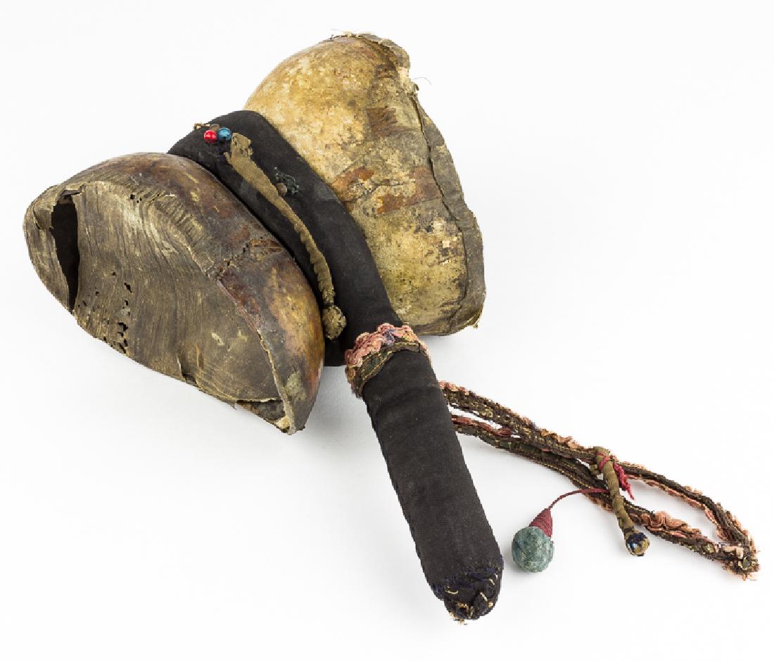 TIBETAN HUMAN CRANIUM DAMARU: TIBETAN HUMAN CRANIUM DAMARU In Tibet, the human cranium is used in making the damaru, a drum with whirling balls. Two skulls are combined and monkey skins are stretched over the skull to serve as dru