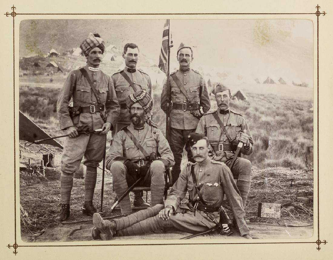 BOER WAR PHOTOGRAPH ALBUM: Spectacular photograph album apparently prepared by a British officer and filled with images of Boer and British soldiers taken during the Second Boer War, 1899-1902. The red clothbound album, 11" x 9