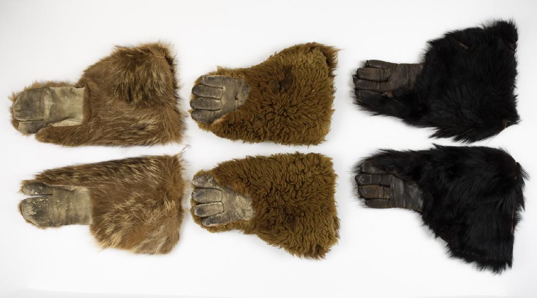 TRAPPERS' GLOVES (6): Lot of three pairs of antiques trappers' gloves, includes one set each of gloves, medium size, leather palm, with gauntlets and hand tops covered with grizzly bear, black bear and bison fur. Very good