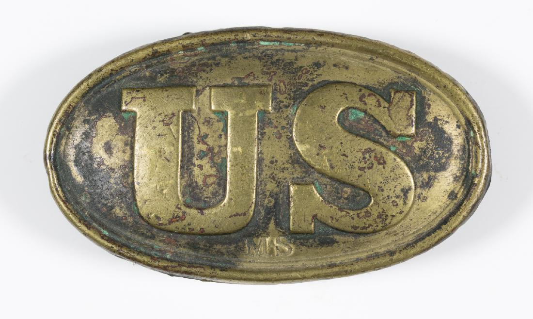 SMALL PATTERN 1839 U.S. BELT PLATE: Small Pattern 1839 U.S. belt plate, approx. 2 3/4" x 1 1/2", cast-brass face with the initials "MS" stamped at the bottom edge. The reverse is lead filled and fitted with an arrow-style hook and tongu