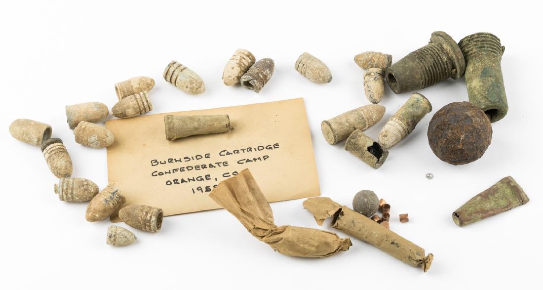 CIVIL WAR AMMUNITION AND ARTILLERY RELICS: Good lot of 22 pieces of Civil War-era ammunition, bullets or cartridge cases, includes: two brass-cased cartridges and one spent casing for the Spencer repeater; two brass cartridge cases for the Bur