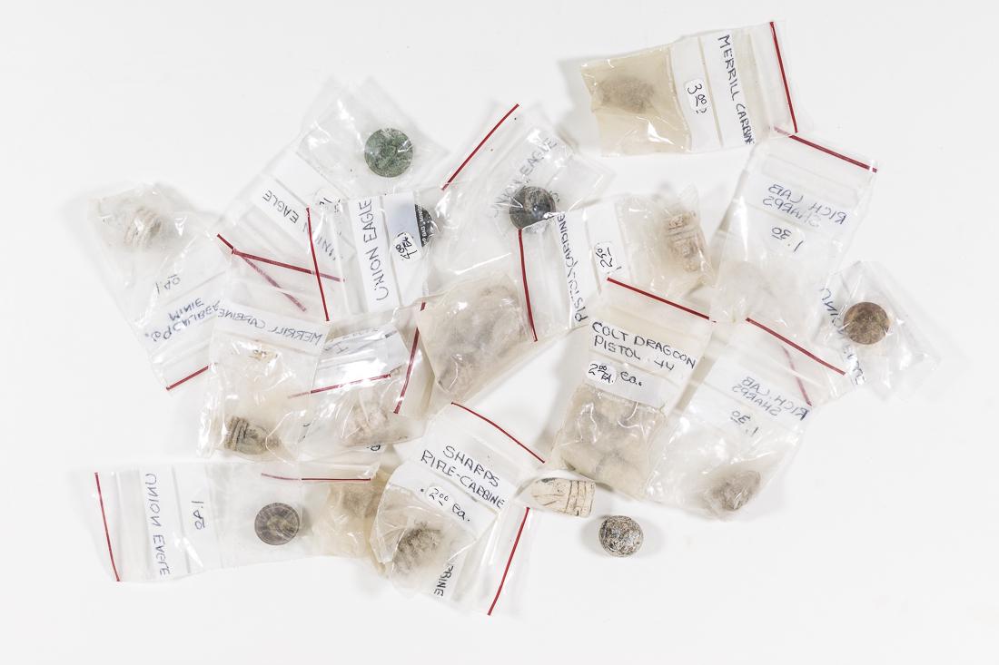 CIVIL WAR BULLETS AND BUTTONS: Group of 28 "dug" Civil War dropped bullets and buttons, includes Merrill Carbine, Sharps, .69 Minie, Colt Dragoon, etc. No rarities.