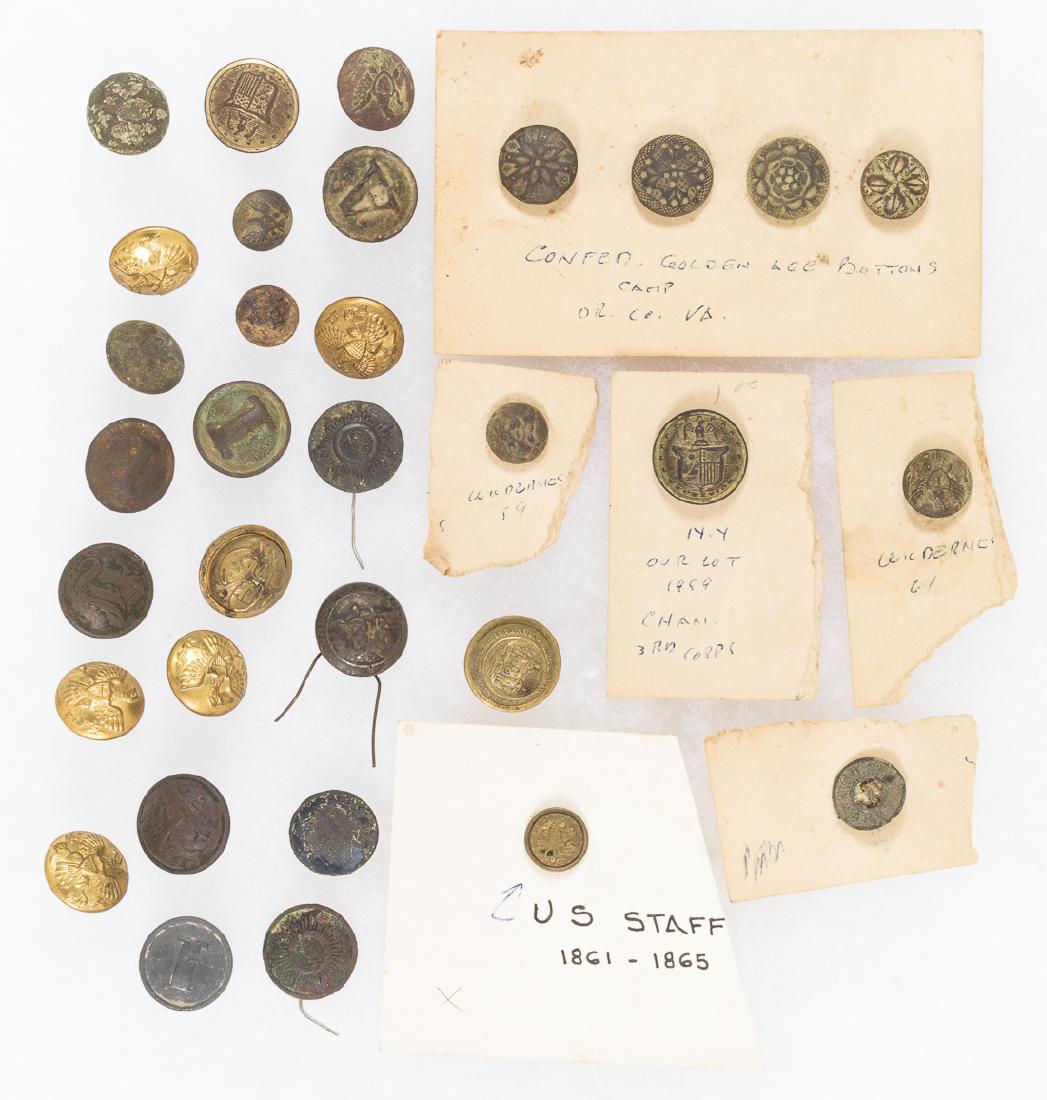 CIVIL WAR BUTTONS: Good lot of 32 Union and Confederate uniform buttons of the Civil War, with Confederate examples comprised of four floral-patterned "golden age" buttons and three bearing North Carolina titles and mot