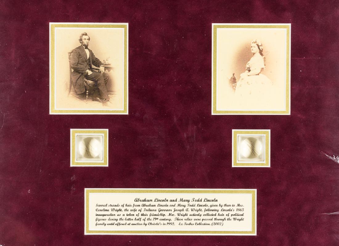 ABRAHAM AND MARY LINCOLN HAIR DISPLAY: A fine pair of Lincoln relics, a total of about a dozen strands of hair of both Abraham Lincoln and Mary Todd Lincoln, separately contained within small magnifying cases matted beneath reproduction im