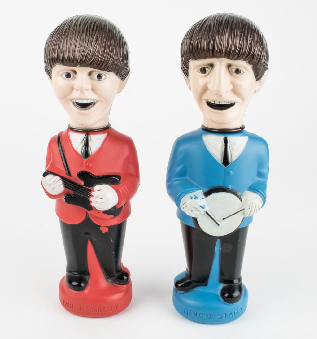 (BEATLES) "PAUL" AND "RINGO" BUBBLE BATH DOLLS: Vintage pair of Colgate Palmolive Beatles "Bubble Bath Dolls", each plastic figure 10" tall with a screw-on cap within a removable head. The bodies, once sold in cardboard boxes, once contained bubble