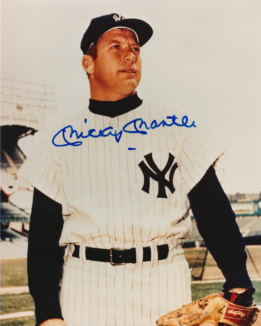 MICKEY MANTLE: (1931 - 1995) Yankee Hall of Famer who hit 536 home runs and was a Triple Crown winner and three time M.V.P. S.P., 8" x 10" color, a waist-up view of Mantle with glove in his Yankees uniform, signed b