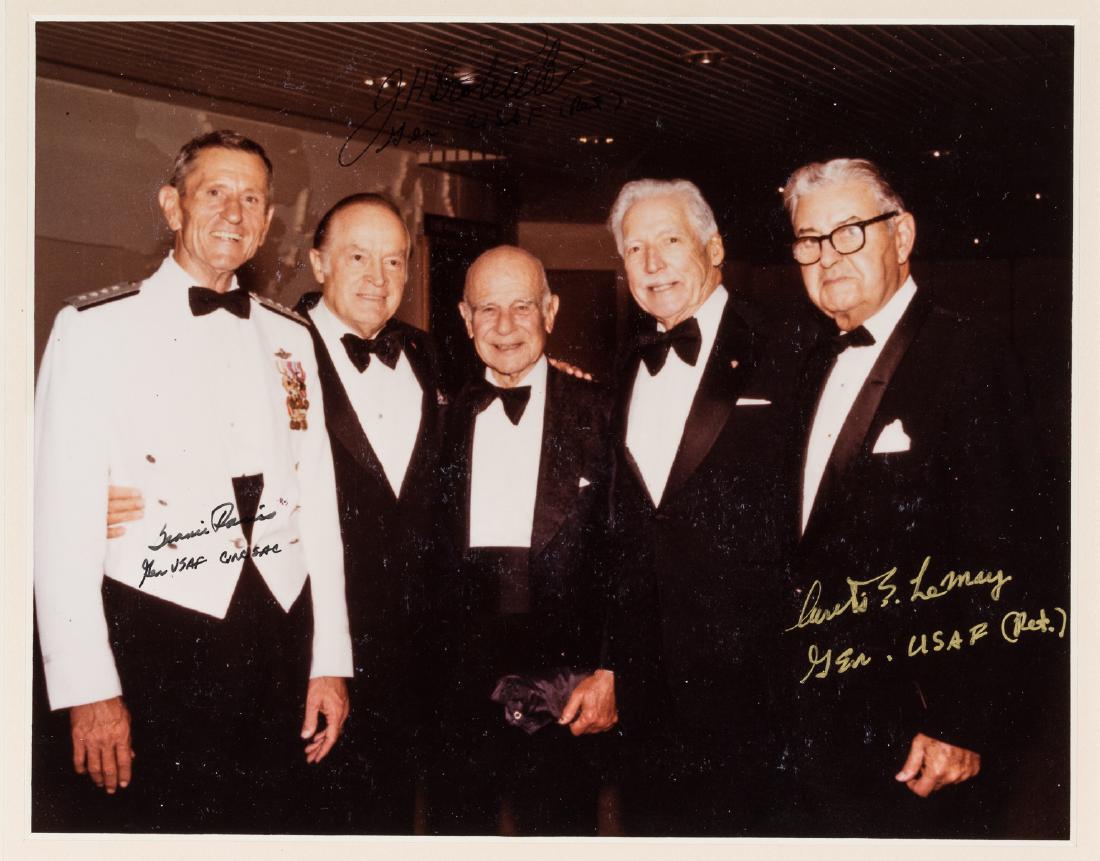 WORLD WAR II AIR FORCE GENERALS: S.P. 8" x 10" color, a candid photo showing comedian Bob Hope with four other men, signed by three beside their images: JAMES H. DOOLITTLE who adds rank (poor contrast), CURTIS LEMAY, who also adds hi
