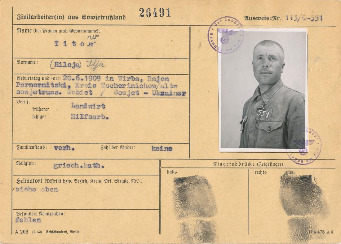 RUSSIAN SLAVE LABOR PERSONNEL CARD: Personnel card maintained by authorities on Soviet slave laborer Ilya Titow, b. 1909 in Wirba, Ukraine and a farmer and laborer. The oblong 8vo. card bears the man's photo and prisoner number, and not