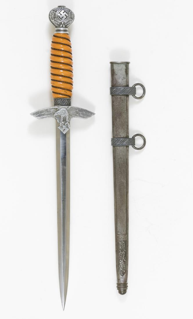 LUFTWAFFE SECOND MODEL DAGGER BY CARL EICKHORN: Luftwaffe officer's dagger, second model, 10" blade, 15" overall. The pommel nut shows a few minute scratches and minor wear, but is in better condition than usually seen. The orange celluloid handle 
