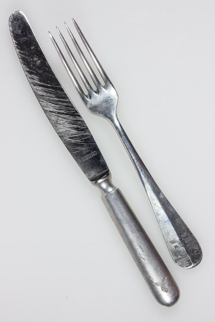 LUFTWAFFE TABLEWARE: Two pieces of Luftwaffe tableware, a 8 1/4" fork and 10" knife, both aluminum (knife blade is steel), with the handles stamped with Luftwaffe eagles, the fork dated 1938. Very good.