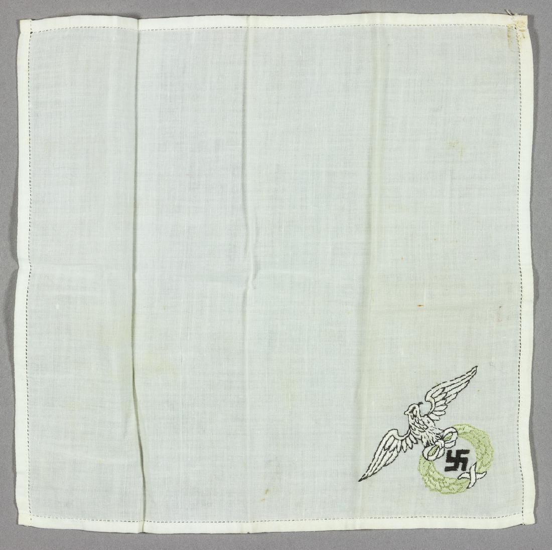 N.S.D.A.P. HANDERCHIEF: High-quality linen handkerchief, 8 1/2" x 8 1/2", bears a large, detailed embroidered NSDAP eagle and swastika at one corner. Very good.
