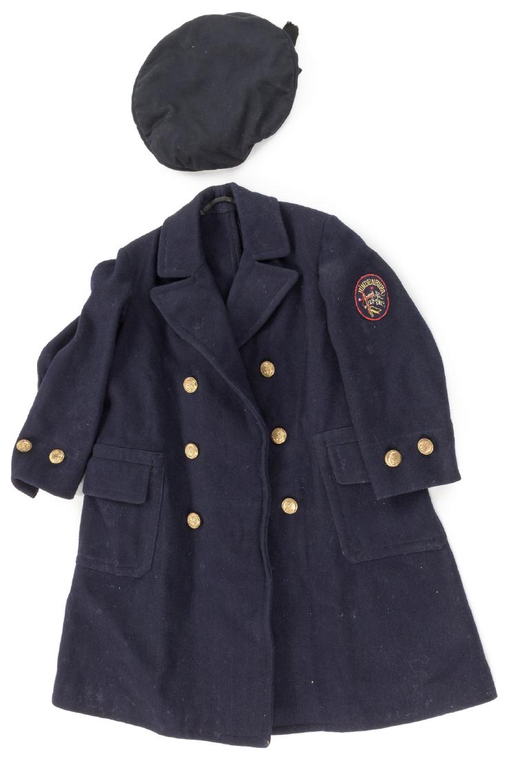 BATTLECRUISER "HINDENBURG" CABIN BOY'S UNIFORM: Scarce World War I-era naval uniform item, the overcoat of a cabin boy of the "Kaiserliche Marine", or Imperial German Navy. The child-sized coat is manufactured from blue wool in the double-breasted