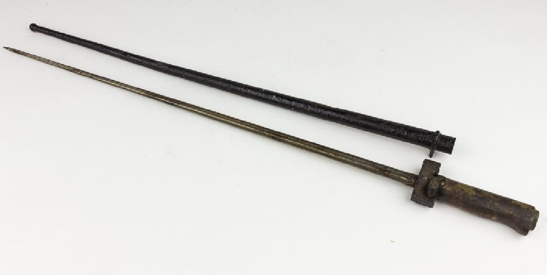 FRENCH LEBEL RIFLE BAYONET: French M 1886 "Lebel" or "Fusil" Bayonet with its original steel scabbard. This bayonet is a wartime variation of the Lebel which does not have the hooked quillion. The bayonet has a full-length, tape