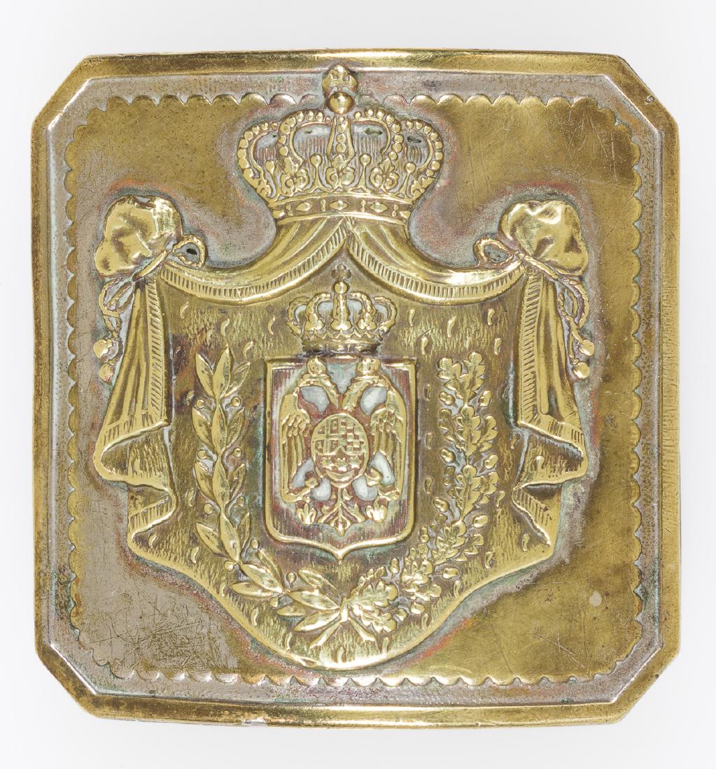 ROYAL YUGOSLAV ARMY OFFICER'S BELT BUCKLE: Circa 1930's gilt-finished belt buckle, 2 1/4" square, depicting that fighting's force's coat of arms as a separately applied emblem affixed with two rivets on the reverse. The reverse also bears the