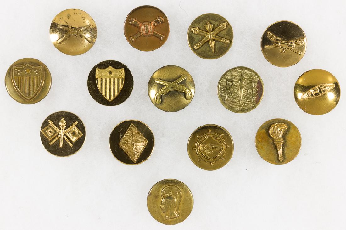 U.S. ARMY BRANCH OF SERVICE BUTTONS: Good lot of fourteen World War II and later brass U.S. Army branch of service buttons, including those indicating Military Police, Signal Corps, armor, artillery, etc. All retain original fasteners, w