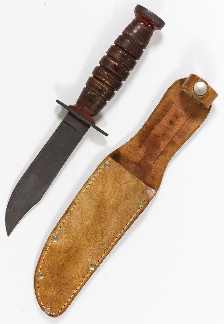 U.S. PILOT SURVIVAL KNIFE BY SCHRADE-WALDEN: U.S. military pilot survival knife, 5" blade, 9 Â¾" overall, officially designated "MIL-k-8662(AER)" and issued 1953-1957. The grip is constructed of knurled brown leather washers, with steel hand g