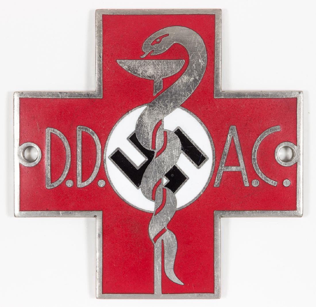 GERMAN AUTO CLUB AMBULANCE PLAQUE: Rare German bright metal plaque, 3 1/4" square, depicting a red cross in enamel, with a caduceus over a white disk containing a mobile swastika at center, and with the initials "D.D.A.C", for "Der Deu