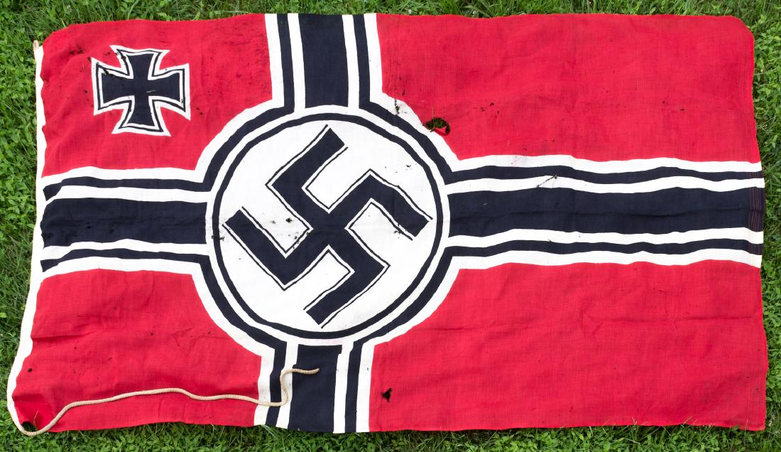 KRIEGSMARINE "REICHSKRIEGSFLAGGE": Very large Kriegsmarine "Reichkriegsflagge" ("battle flag"), 59 1/2" x 95", of red wool bunting construction, clamp-dyed with a black and white cross offset towards the hoist, with a black mobile swas