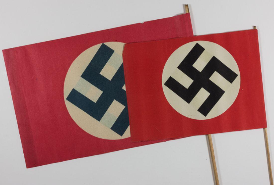 GERMAN PAPER FLAGS: Good group of four paper flags, each measuring between 9" x 6 1/2" and 12" x 8", with two depicting the black-white-red tricolor of Imperial Germany, and the remaining two featuring the swastika of th