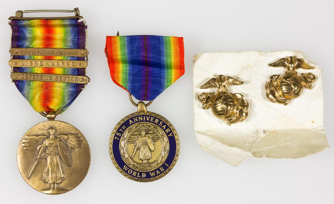 WORLD WAR I VICTORY MEDAL WITH BATTLE CLASPS: U.S. Army World War I victory medal in bronze, 1 ½" dia., depicting a winged Victory with sword and shield on the obverse, with the reverse displaying a double-blade â€œfasces” over a