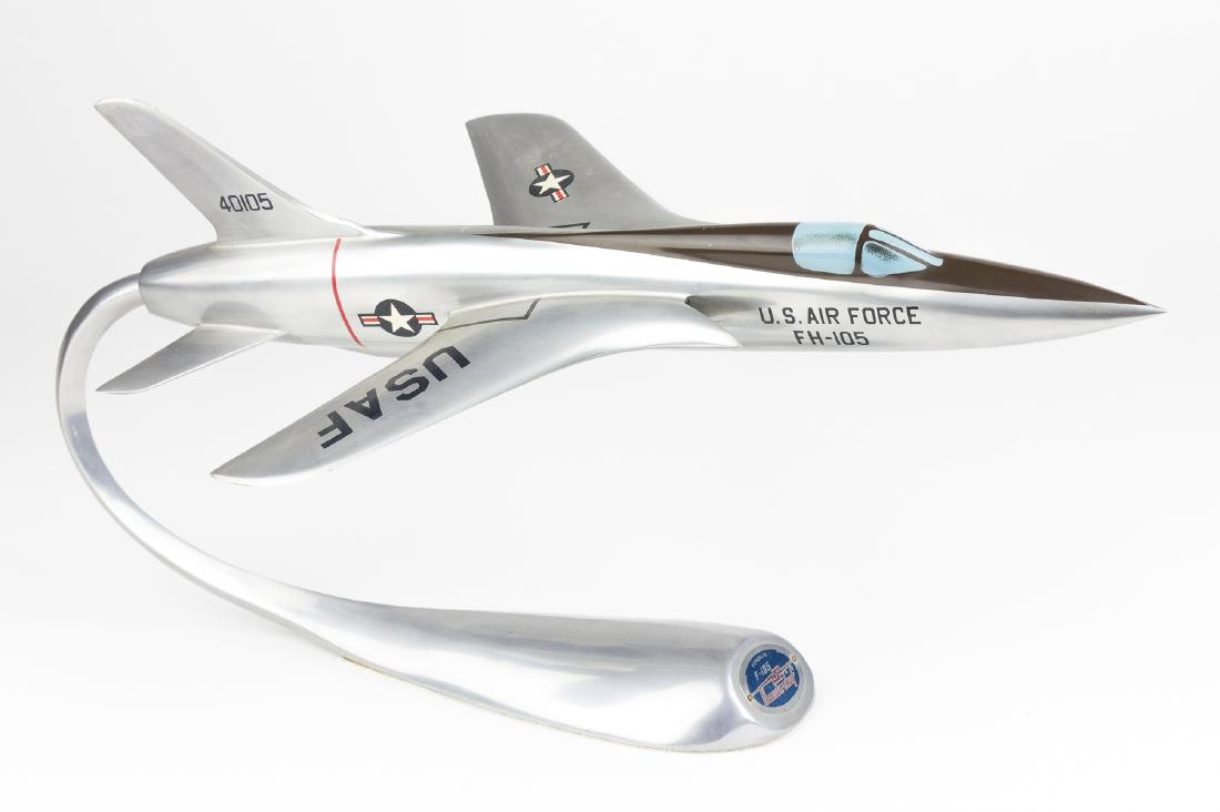 REPUBLIC F-105 MODEL AND STAND: Scarce, period model of a Republic F-105 Thunderchief distributed by Republic Aircraft and created by Air Parts International, Netherlands. The all-metal model includes the 15 3/4" jet with painted an