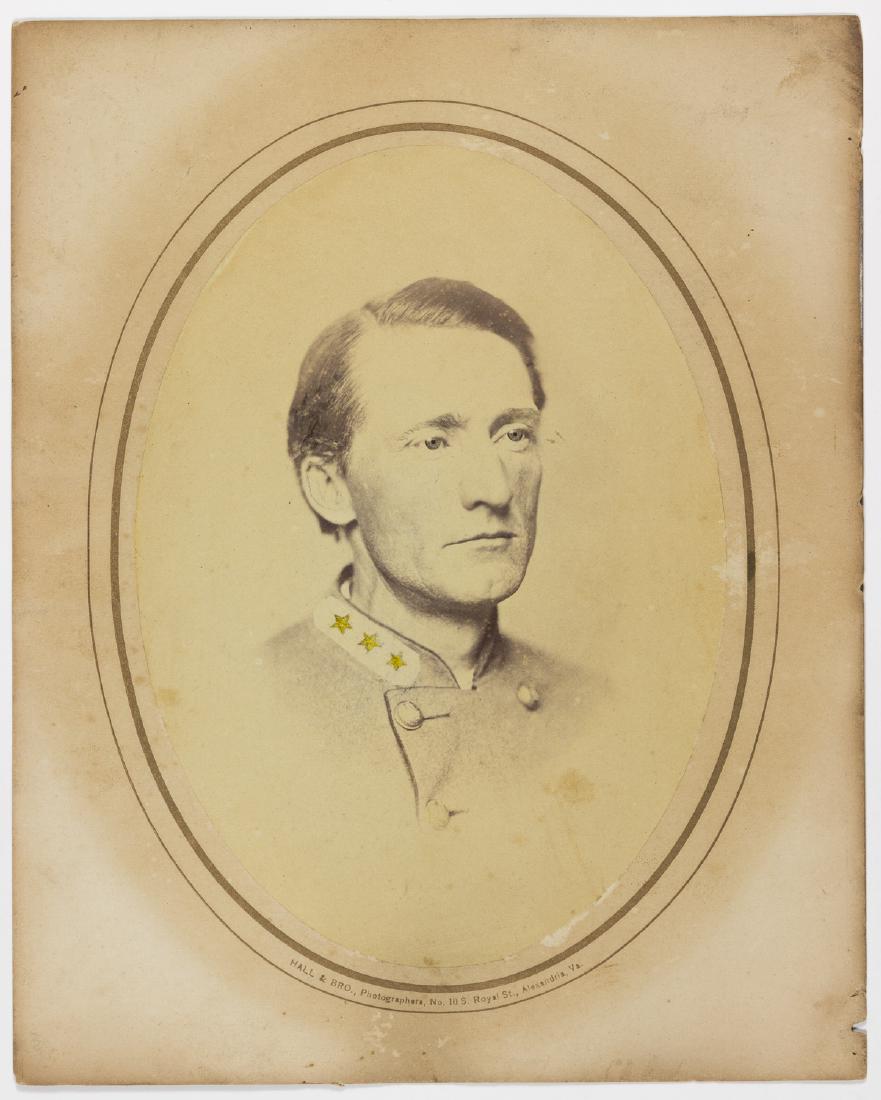 JOHN S. MOSBY ORIGINAL PHOTO PORTRAIT: Fine original albumen photo portrait, approx. 5 1/4" x 7 1/2" sepia on a 7 1/2" x 9 1/2" mount, a chest-up, three-fourths profile portrait of infamous Confederate cavalry raider JOHN S. MOSBY (1833-19