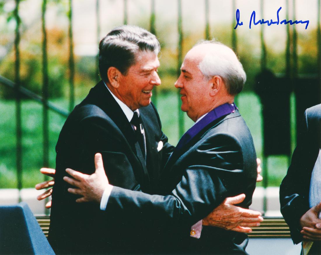 MIKHAIL GORBACHEV: (b. 1931) General Secretary of the Soviet Union's Communist Party who instituted policies of government openness and restructuring. S.P., 8" x 10" color, a fine waist-up view of Gorbachev sharing a hu